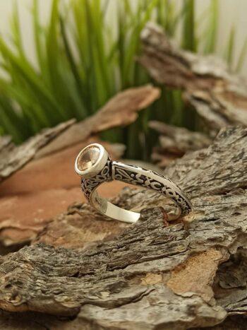 Пръстен от сребро с циркон и отвори